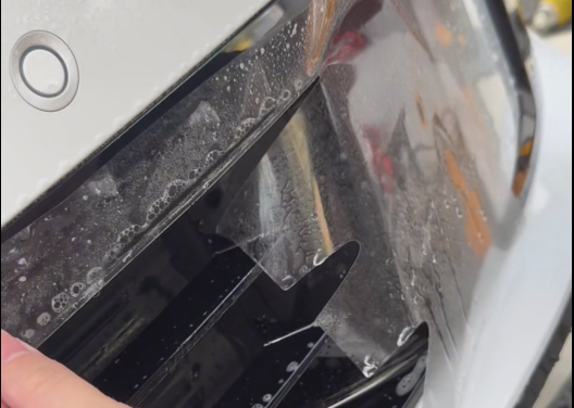 PPF film installation around a complex vehicle edge and trim area