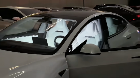 white-tesla-panoramic-glass-roof-clear-window